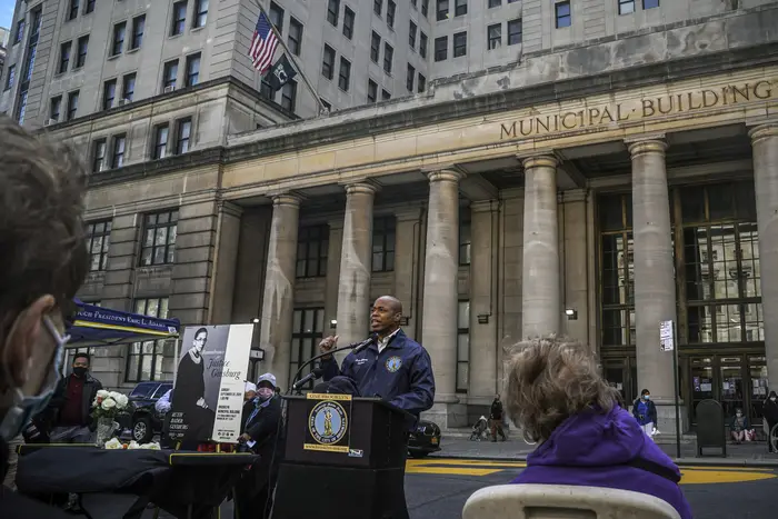 Brooklyn Borough President Eric Adams, center, speaks during a public remembrance to honor the life and legacy of U.S. Supreme Court Justice and former Brooklynite Ruth Bader Ginsburg, outside Brooklyn's, Municipal Building, in New York.
